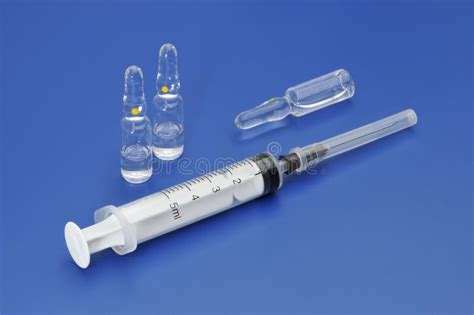 Plastic Disposable Syringe And Glass Ampoules With Medicine Stock Photo