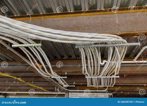 The Installation Of Electrical Wires In The Ceilings Of A Newly