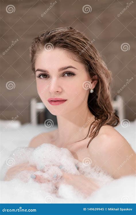 Attractive Blonde Woman Lying In Bathtub In Foam In Hotel Stock Image Image Of Female Clean