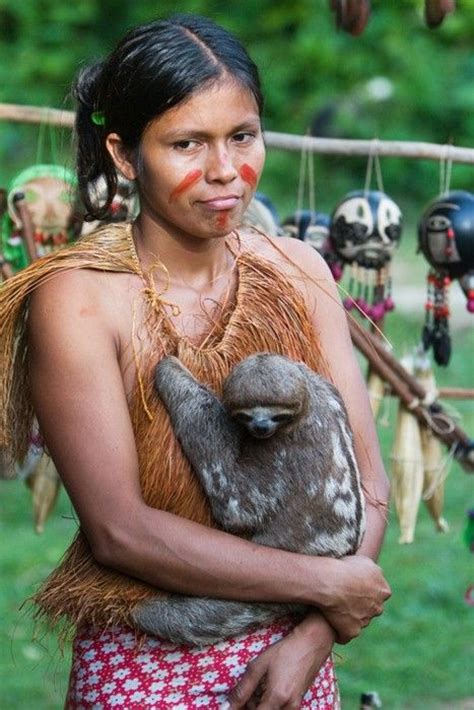 It is also has a long life, often surviving for 30 years or more. A girl of the Yagua tribe near Iquitos, Peru, holds her ...