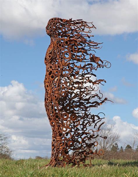 A Sculpture Of A Woman Made From Scrap Metal Rdamnthatsinteresting