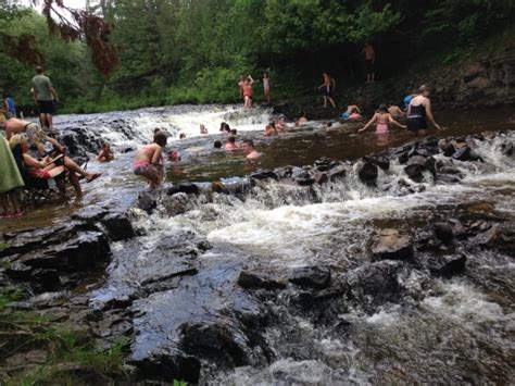8 Awesome Waterfalls In Michigan Where You Can Swim This