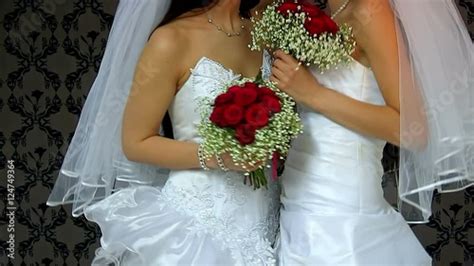 Stock Video Of Wedding Lesbians Girl In Bridal Dress Kissing Wallpaper In Background Happy