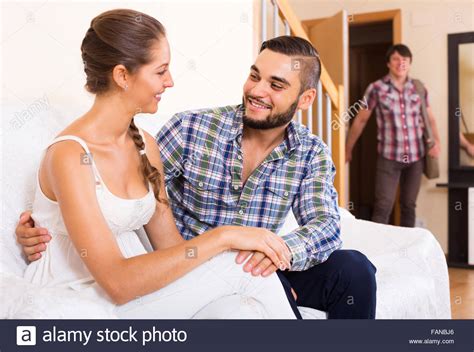 Upset Adult Discovering Cheating Partner At Home Stock Photo Alamy