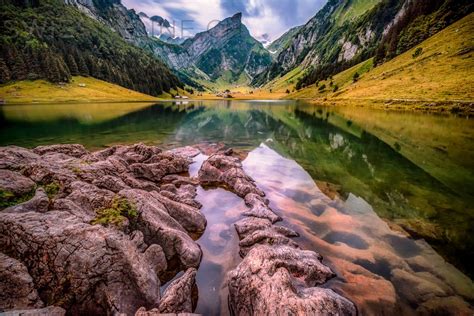 Seealpsee is a lake in the alpstein range of the canton of appenzell innerrhoden, switzerland. swisskyline.ch - Seealpsee Summer Sunset online kaufen ...