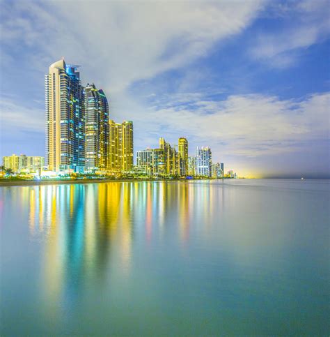 Skyline Of Sunny Isles Beach By Night With Reflections At The Surface
