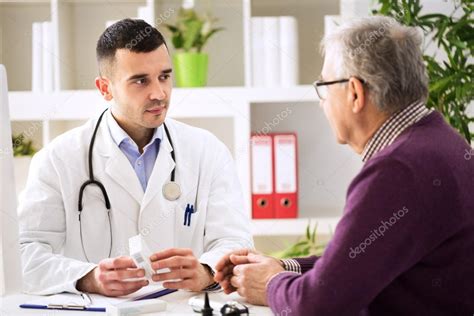 Doctor Consulting Patient With Medicine Drugs Stock Photo By ©didesign