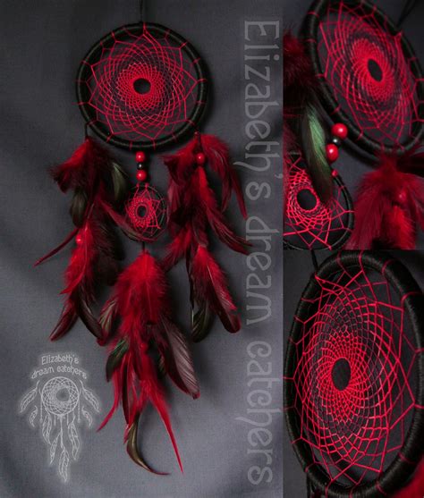 Three Red Dream Catchers With Feathers On Them