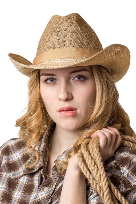 A Woman Is In A Cowboy Hat With A Rope On Her Shoulder Stock Image