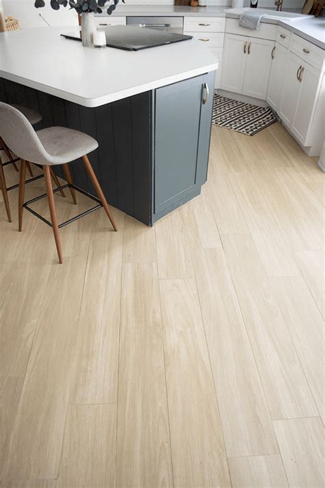 Wood floor with tile inlay in kitchen. Our New Wood Look Tile Floors | Wood look tile floor ...