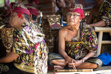The street musicians are doing their business with the many tourists who visit the park. BALI, INDONESIA, DECEMBER, 24,2014: Senior Musician With ...