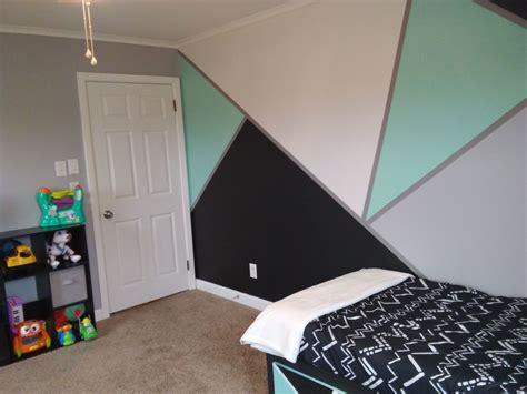 This backdrop is quiet and allows your colors to make their statement in. Mint black grey white geometric walls. Awesome boys room ...