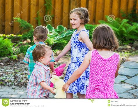 Children In A Circle Playing Ring Around The Rosie Stock Image Image