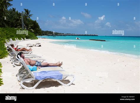 Maldives Beach Tourists Sunbathing On The Beach Kuramathi Resort