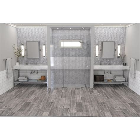 Grey bathrooms are having a big moment this year. Lumber Gray Wood Plank Porcelain Tile | Wood plank tile ...