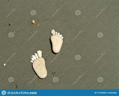 Stone Footprints On Beach Sand Stock Photo Image Of Pebble Stone