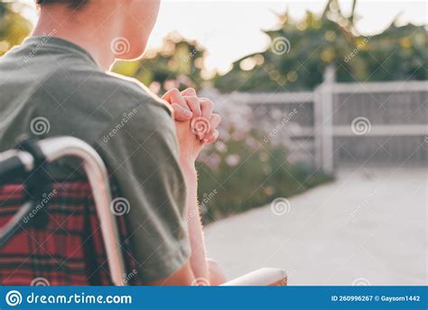 Young Man With Disability Intertwined To Pray For Blessings Stock Image