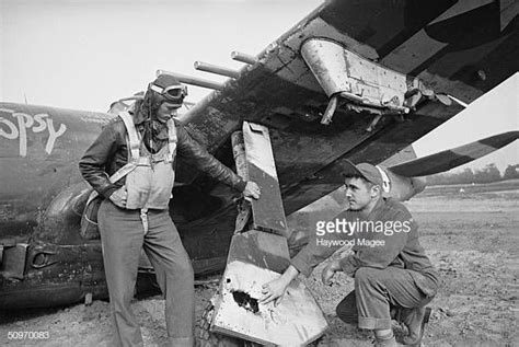 Lieutenant Q Aanenson Inspects The Damaged Undercarriage Of His P47
