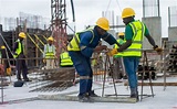 Construction Workers on the Building Site · Free Stock Photo