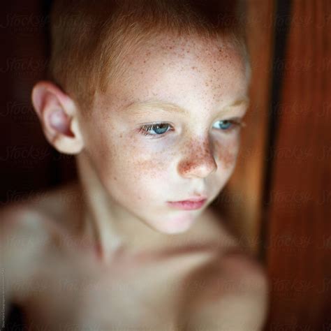 Portrait Of Young Boy No Shirt Red Hair Blue Eyes And Freckles His