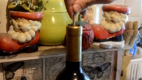 Take a hammer to it (source: How to open wine bottle without a corkscrew - YouTube