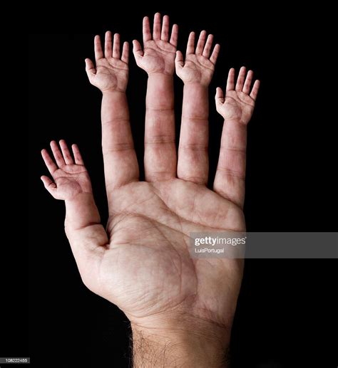 Hand With Minihands On Finger Stock Photo | Getty Images