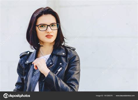 Beautiful Young Girl In Glasses In Stylish Clothes On Light Back Stock