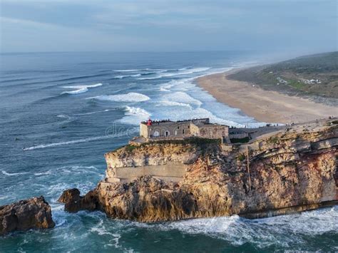 Lighthouse In Nazare Portugal Famous Place For Waves And Surfing