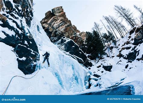 Ice Climbing Male Climber On A Icefall In Italian Alps Stock Photo