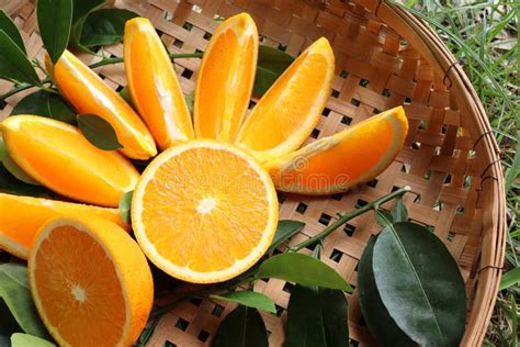 Orange Fruit Fruits Or Vegetables Half And Slice With Green Leaves