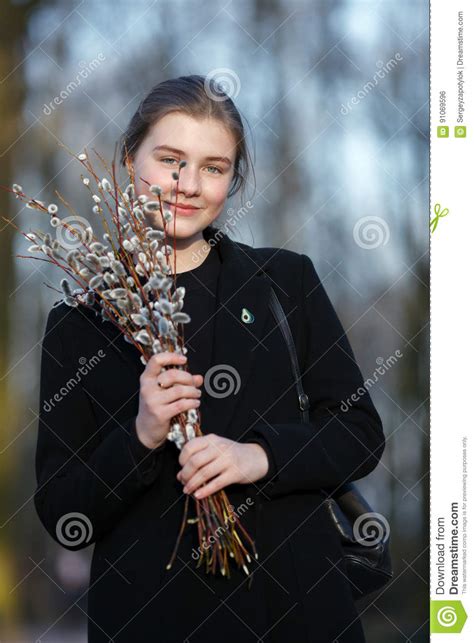 Emotional Portrait Of Young Happy Beautiful Woman With A Bouquet Of