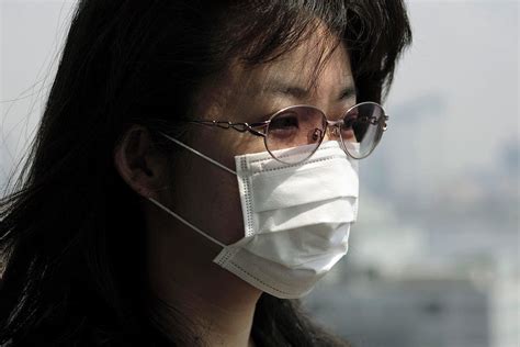 Woman Wearing A Face Mask Photograph By Andy Crumpscience Photo