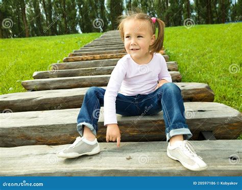 Cute Little Girl Is Sitting On Stairs Royalty Free Stock Image Image