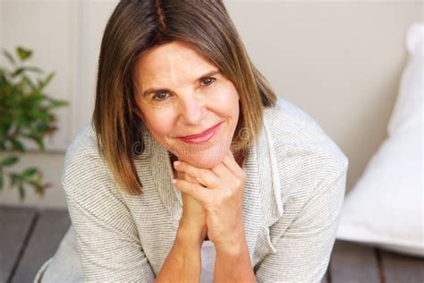 attractive older woman smiling and sitting outside stock image image of portrait mature 92171791