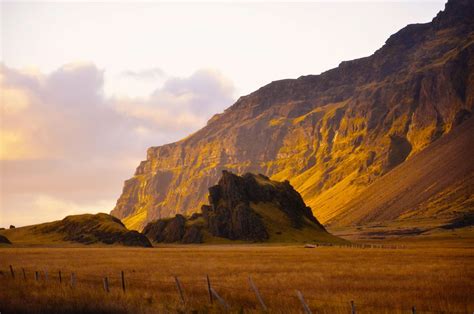 3840x2544 Cliff Clouds Iceland Mountain Rock Sunset 4k Wallpaper