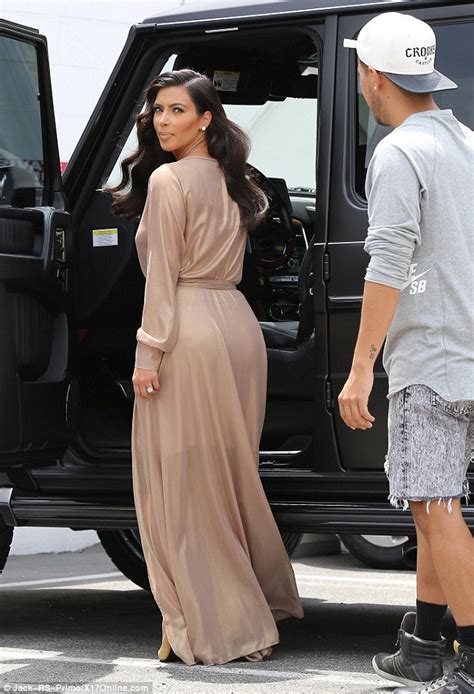 kim kardashian sizzles in sexy beige dress with high cut slit daily mail online