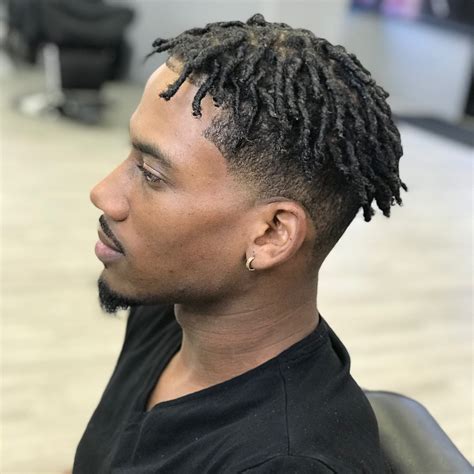 A lot of gel is used to keep the hair in place, however, the lateral comb over gives this greaser a more intellectual appearance. 28 Best Haircuts For Black Men In 2018 - Men's Hairstyles