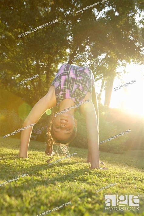 Girl Doing Backbend On Grass Stock Photo Picture And Royalty Free