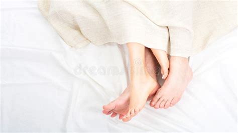 Close Up Of Feet Couple Having Sex On A Bed At Home In The Night Feet Of Couple In Comfortable