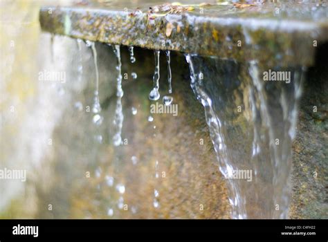 Water Dripping Over A Ledge Stock Photo Alamy
