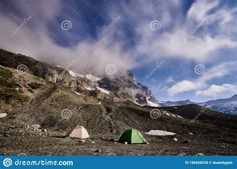 Scenery Of Mountains And Starry Night Sky Stock Photo