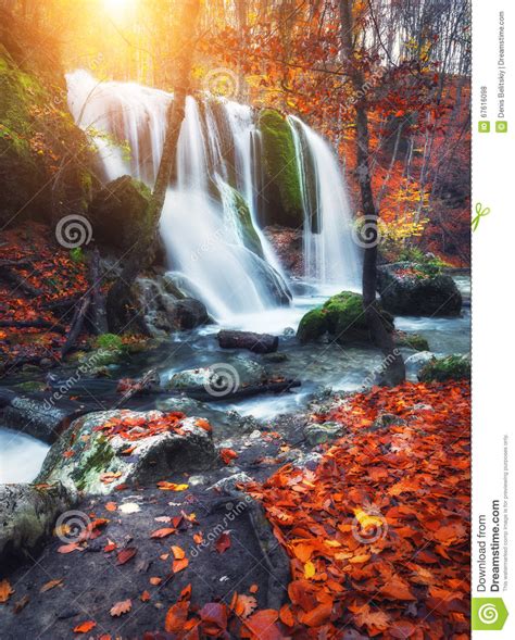 Waterfall At Mountain River In Autumn Forest At Sunset Stock Photo