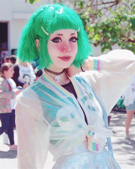 A Woman With Green Hair Wearing A White Dress