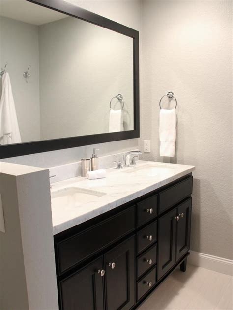 Having the right types, shapes, and sizes of mirrors ensures the best match. Contemporary Bathroom with black vanity and mirror - on ...