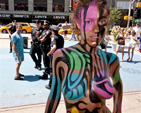 Just confirming the current local time? Artist paints naked models in Times Square for 'Only in ...