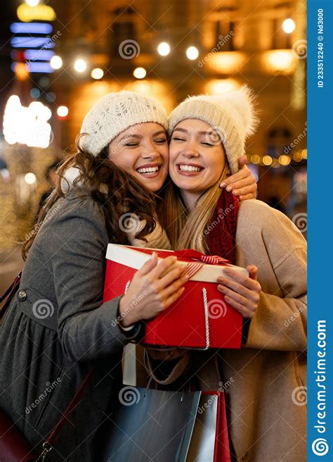 Portrait Of Happy Women Exchanging Christmas Presents Holiday People