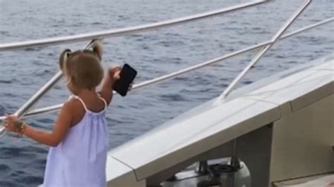Watch Girl Throws Dads Phone Into The Sea When He Wont Put It Down