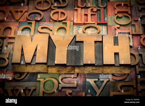 Myth Word In Wood Type Against Background Of Letterpress Printing