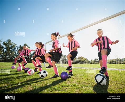 Girl Soccer Players Practicing Near Net Stock Photo Alamy