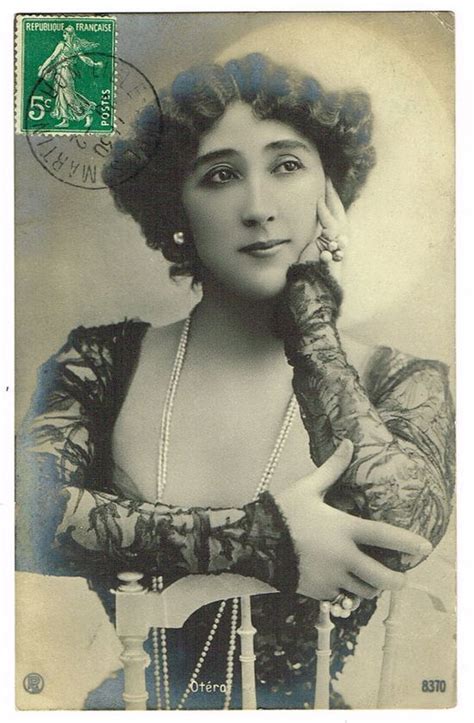 An Old Photo Of A Woman With Gloves On